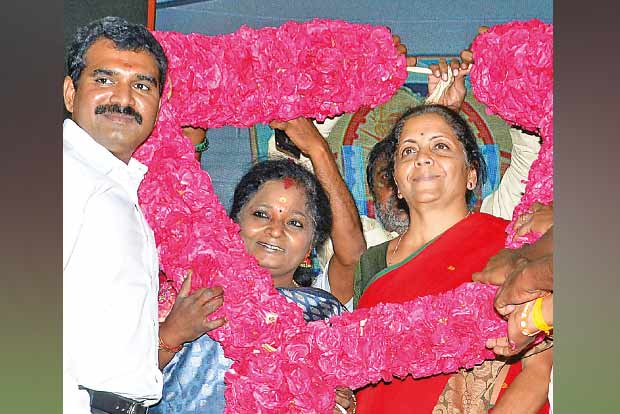 BJP State President Tamilisai Soundararajan garlanding Defence Minister Nirmala Sitharaman on Sunday