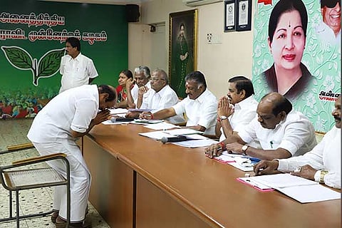 One of the aspirants bow before the AIADMK poll panelists comprising CM and OPS during the interview