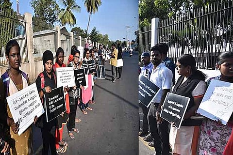 People stage a human chain protest near the Marina Beach in Chennai on Friday, demanding stringent action