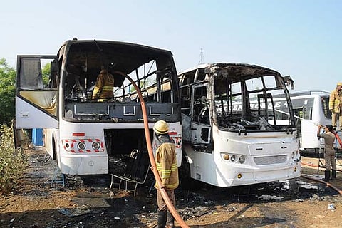 Fire and Rescue Service personnel dousing the fire in the buses parked near Vellore new bus stand on Tuesday