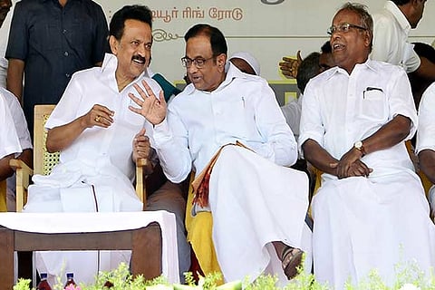 DMK president MK Stalin discussing a point with ex-Finance Minister Chidambaram in Madurai on Thursday
