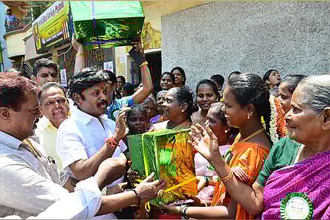 AMMK South Chennai candidate Esakki Subaya campaigning with the ?gift pack? symbol in Saidapet on Friday