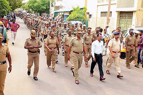 Karur SP T K Rajasekaran and district collector T Anbalagan lead a  flag march in Aravakurichi on Wednesday