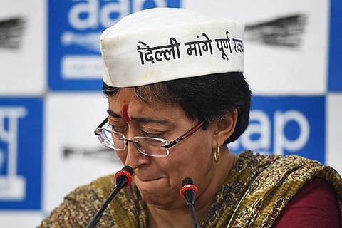 Aam Aadmi Party (AAP) East Delhi candidate Atishi breaks down during a press conference