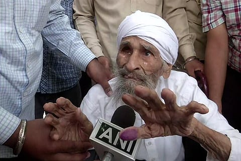 Delhi's oldest voter, 111-year old Bachan Singh after casting his vote.