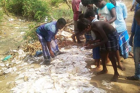 People search for their Aadhaar cards from the heap