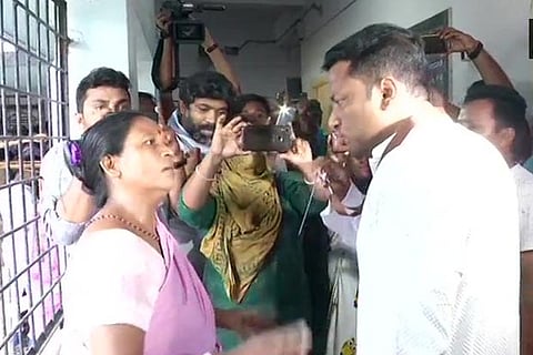 BJP MP candidate Anupam Hazra (R)  at polling booth