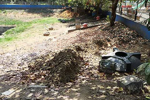 Silt removed from the pond left inside the park