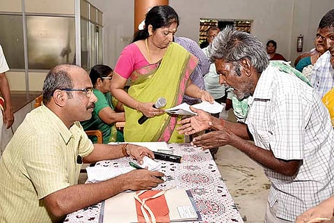 District Collector S Sivarasu recieves a petition from an elderly man, in Tiruchy on Monday