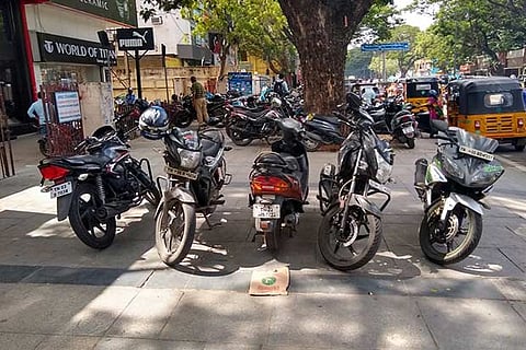 Bikes and cars parked on the pavement in Pondi Bazaar on Thursday
