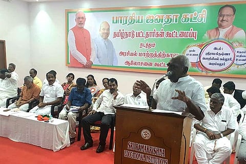 Former union minister Pon Radhakrishnan addresses BJP workers at a meeting in Perambalur on Monday