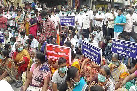 Residents protest with masks against garbage yard in Tirupur district