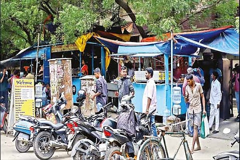 A pavement in Royapettah is lined with illegally-run bunk shops
