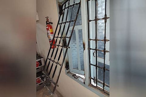 The window of the bank that was cut open with a welding machine by burglars in Tiruvaiyaru on Tuesday