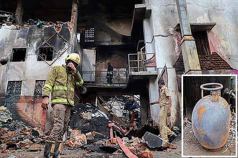 Fire-fighting personnel were deployed to douse the fire; (inset) gas cylinder damaged during the mishap
