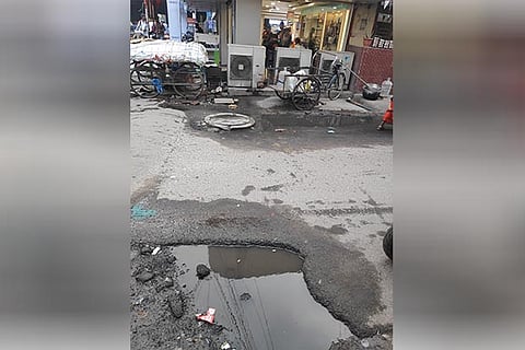One of the potholes on the main road