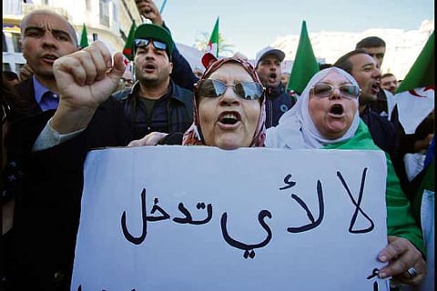 Pro-government supporters rally in Algeria to back planned elections