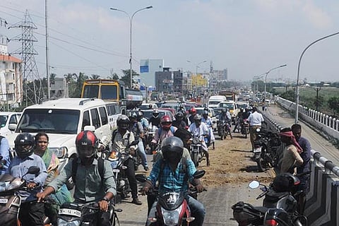 The oil spill on the flyover covered with sand