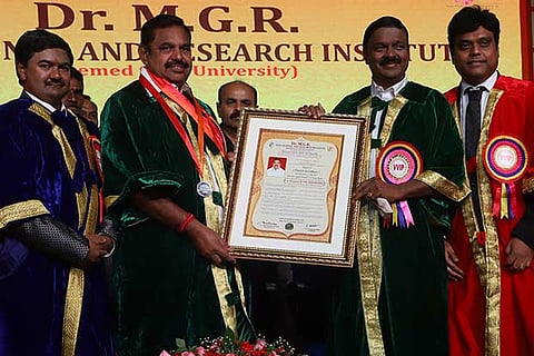 Chief Minister Edappadi K Palaniswami receiving the honorary doctorate from Chancellor AC Shanmugam