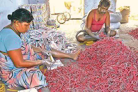 Workers at Sivakasi in Virudhunagar district prepare firecrackers ahead of Deepavali (File photo)