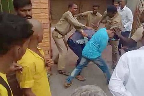 Videograb of MTC crew assaulting the students