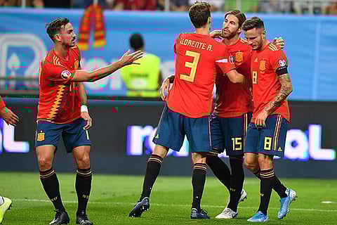 Spain celebrates its 2-1 win over Romania