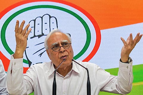 Senior Congress leader Kapil Sibal addresses a press conference on 100 days of NDA Government