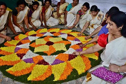 With lavish feast and floral decks, colourful Onam for Keralites post-floods