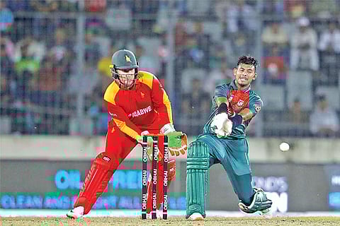 Mossadek Hossain plays a shot during the match against Zimbabwe