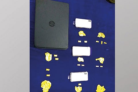 Gold, laptops seized at airport, three detained