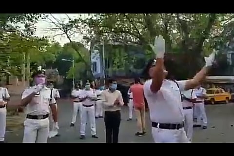 Policeman dons singer's hat to cheer locked down people