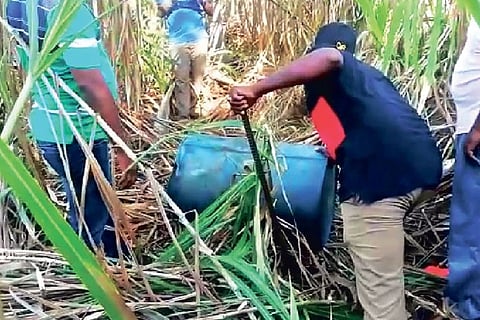 Officials retrieving barrels of arrack in Chengalpattu