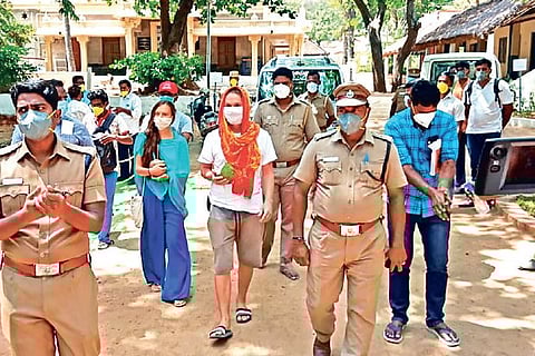 The Russian couple after being brought down by the police