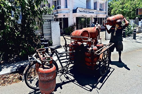 A man delivers LPG cylinder amidst restrictions