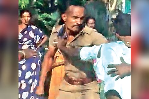 Video grab of a police officer and a tea vendor exchanging blows near Kumbakonam