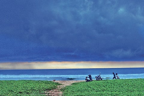 With evening sky turning scary dark, two friends run towards their bike to return home