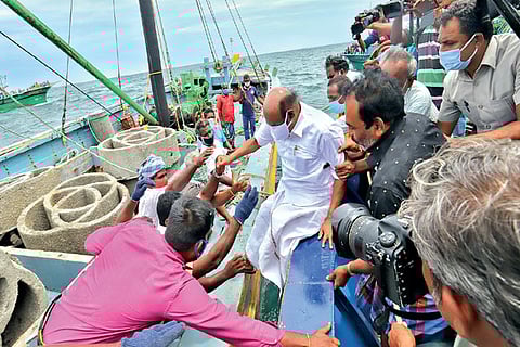 Fisheries Minister takes a boat to flag off a project to set up coral reefs to increase marine