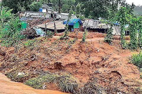 The breached bank of a stream, which is flowing above danger mark after heavy rains in The Nilgiris