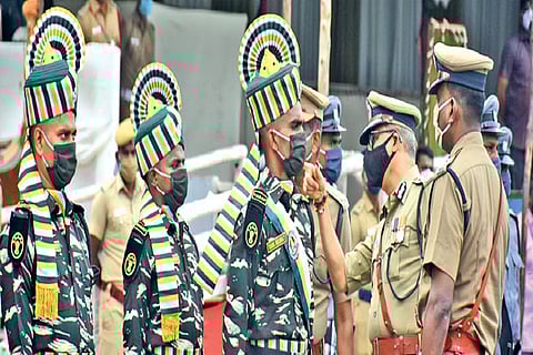 ADGP Shankar Jiwal checking masks on cops participating in the parade during the final rehearsal