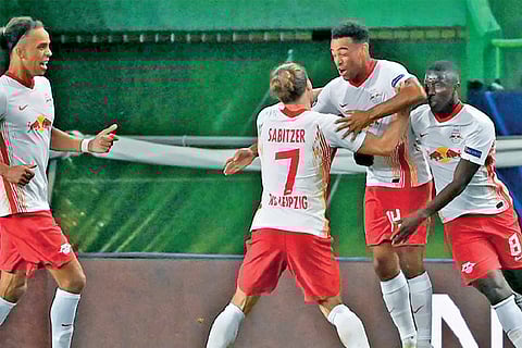 RB Leipzig players are ecstatic after defeating Atletico Madrid