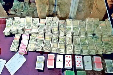 Officials seized Rs 9.5L and 10 decks of cards from apartment
