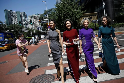 Remove masks, celebrate freedom: fashion grannies return to Beijing street 'catwalk'