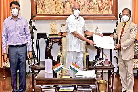 Governor Banwarilal Purohit handing over the order to Professor S Gowri