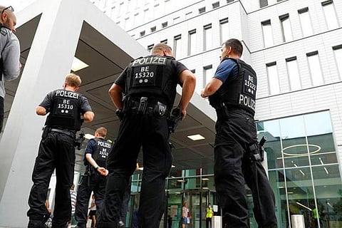 Police officers guard the hospital where Alexei Navalny is receiving medical treatment in Berlin