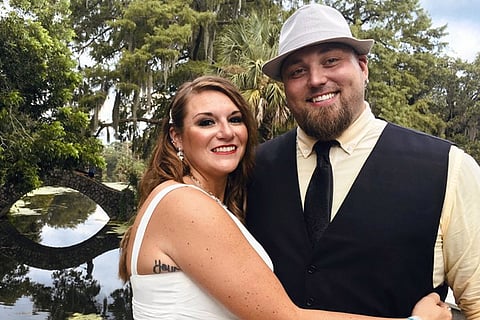 This image released bu Jordan Tyler shows Tyler, right, with his wife Brittany in New Orleans