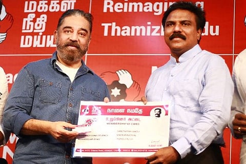 Kamal Haasan inducting former IAS officer Santhosh Babu into MNM party