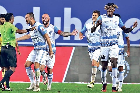 Jamshedpur FC players react after a disallowed goal against Hyderabad FC.