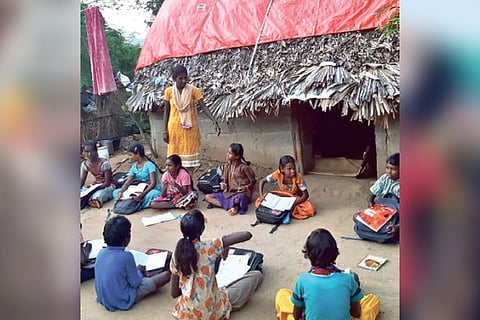Irular children studying in the evening in the hamlet in Pulikundram in Chengalpattu district.