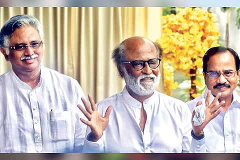 Rajinikanth flanked by Murthy (L) and Manian (R) in Chennai on Thursday.