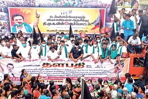 DMK cadre stage protest in Karur.